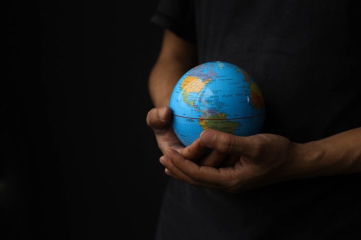 Hand holding earth globe
